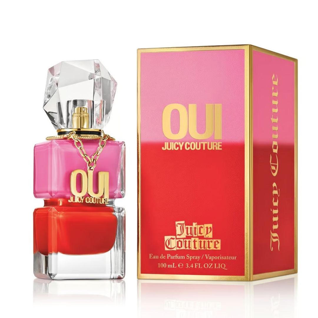 A pink glass bottle of Juicy Couture Oui Eau de Parfum, 100 ml, with a gold cap and a label featuring the fragrance's name and a playful design."